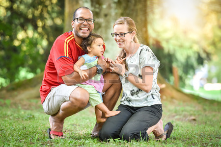 45288422-happy-interracial-family-is-enjoying-a-day-in-the-park-little-mulatto-baby-girl-successful-adoption